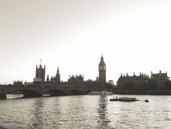 Bridge over river with city in background