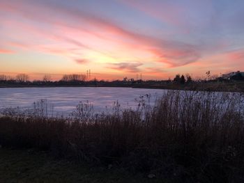 Scenic view of lake during sunset