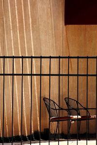 View of chair through fence