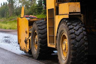 View of yellow wheel at roadside