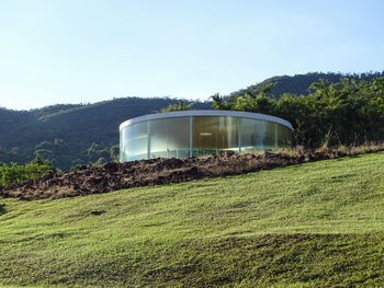 Built structure on field against clear sky