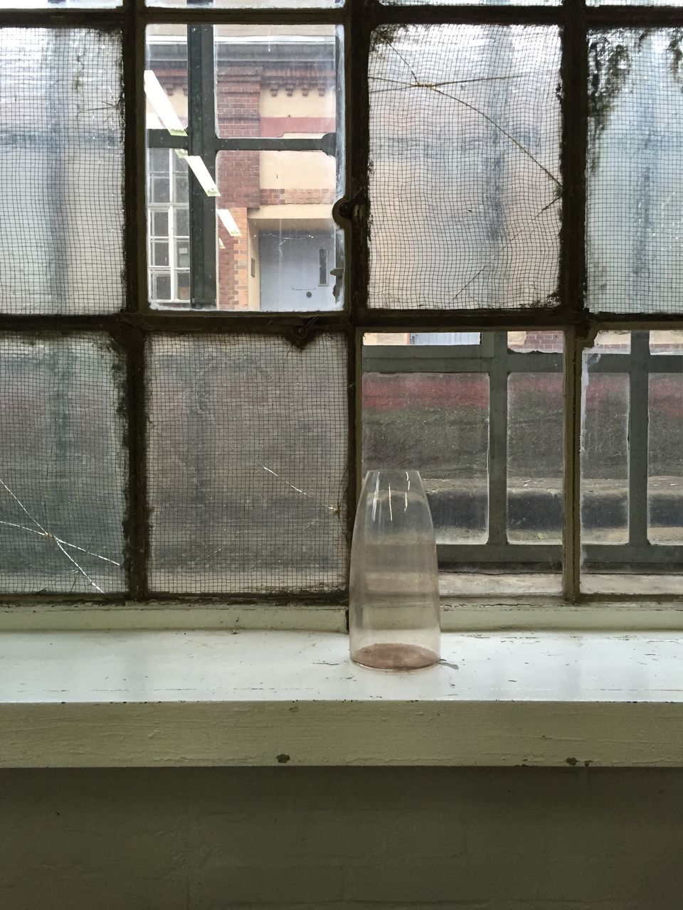 window, glass - material, transparent, day, indoors, no people, architecture, built structure, building, window sill, abandoned, glass, empty, sunlight, container, wall - building feature, window frame, absence