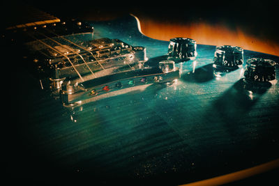 High angle view of guitar at night