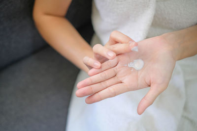 Midsection of woman holding hands