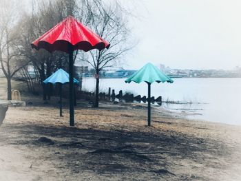 Scenic view of beach against sky during rainy season