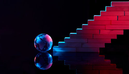 Close-up of spiral staircase against black background