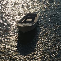 High angle view of boat floating on water