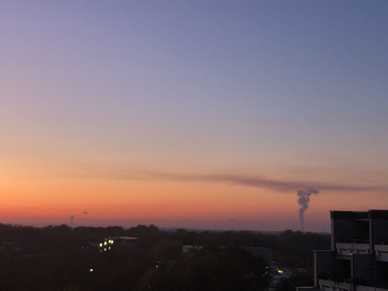 SILHOUETTE BUILDINGS AGAINST ROMANTIC SKY AT SUNSET