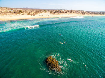 High angle view of sea against blue sky