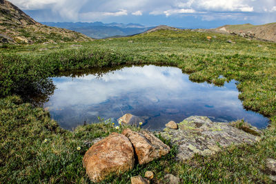 Scenic view of lake and mountains against sky