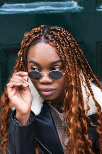 Portrait of young woman wearing sunglasses