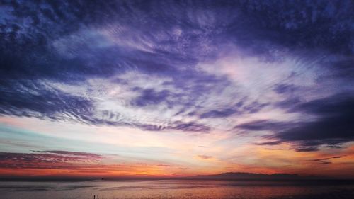 Scenic view of calm sea at sunset