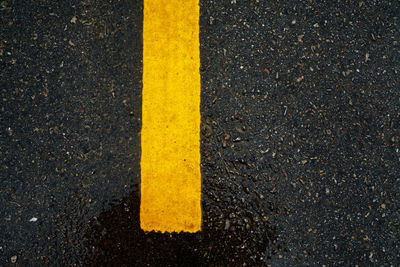 High angle view of yellow line on road