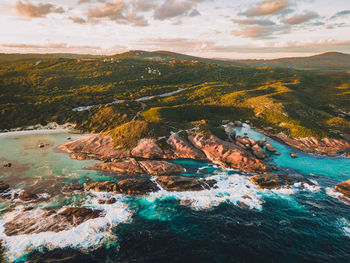 Aerial view of sea and mountains against sky