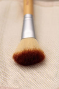 Close up of make-up brush on table