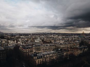 Cityscape against cloudy sky