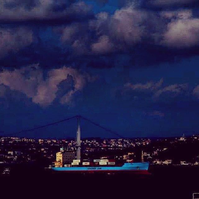 architecture, building exterior, built structure, sky, city, cityscape, cloud - sky, illuminated, cloudy, night, dusk, cloud, residential building, residential district, residential structure, blue, dramatic sky, outdoors, crowded, storm cloud