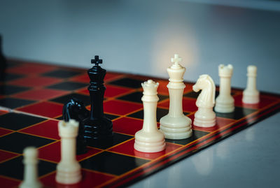 Close-up of chess pieces on table