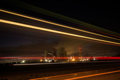 Light trails on road in city at night