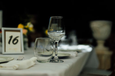 Luxury table settings for fine dining with and glassware, pouring wine to glass. 