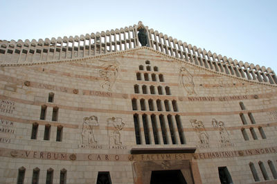 Low angle view of ornate building against sky