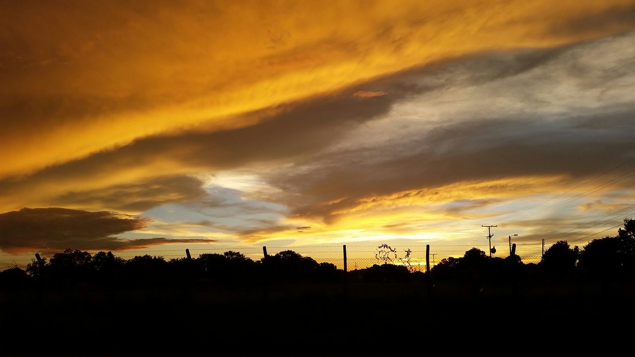 sunset, silhouette, orange color, sky, beauty in nature, scenics, cloud - sky, tranquil scene, dramatic sky, tranquility, nature, idyllic, landscape, cloud, moody sky, cloudy, dark, atmospheric mood, outdoors, outline