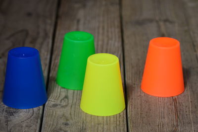 High angle view of multi colored bottles on table