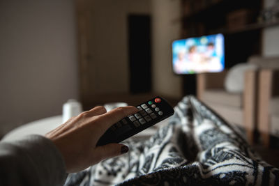 Close-up of hand holding camera