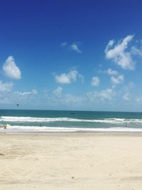 View of beach against cloudy sky