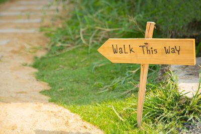 Close-up of information sign on field