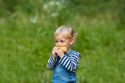 Portrait of boy eating food