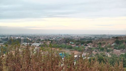 Aerial view of cityscape against sky