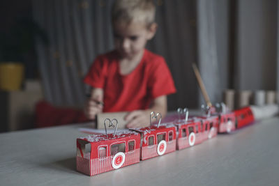 Portrait of boy playing with toy blocks on table