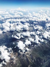 Aerial view of clouds over landscape against sky