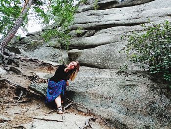 Woman standing on rock