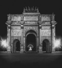 Low angle view of historical building at night