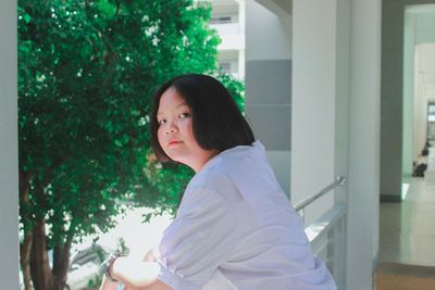 Portrait of a young woman looking away