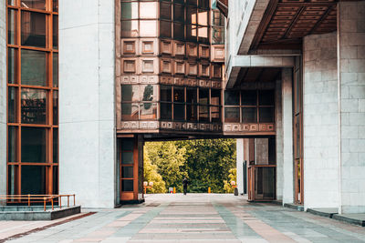Footpath amidst buildings in city
