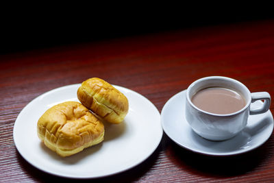 High angle view of breakfast and coffee on table