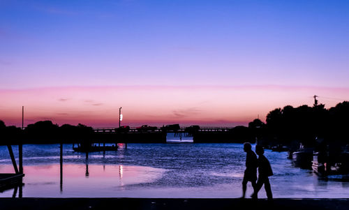 Silhouette of woman at sunset