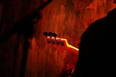 Close-up of hand holding guitar