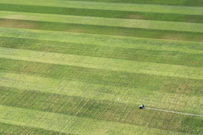 Aerial view of person making yard lines at soccer field