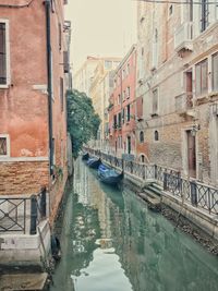 Canal passing through city buildings