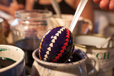 Close-up of patterned easter egg on container