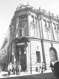 Woman walking in front of building