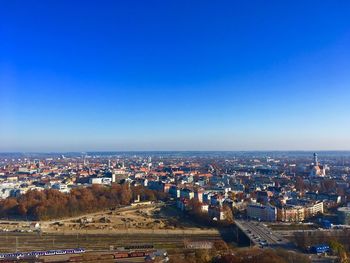 High angle view of townscape against blue sky