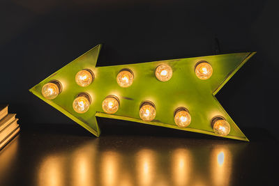 High angle view of illuminated candles on table