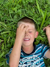 Portrait of smiling boy on grass