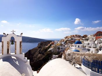 Panoramic view of sea and buildings against sky