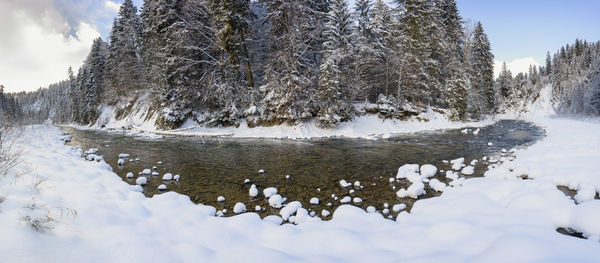 River in canyon with ice and snow at cold winterday